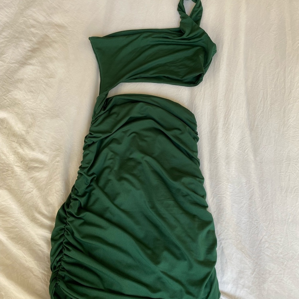 green dress with slit under chest area
